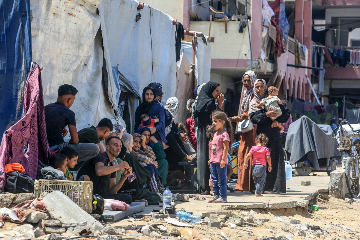 Thousands of displaced Palestinians on their way to find somewhere to stay after Israeli authorities order them to evacuate an area once declared a safe humanitarian zone due, in the eastern part of Khan Younis, Gaza, on July 23.