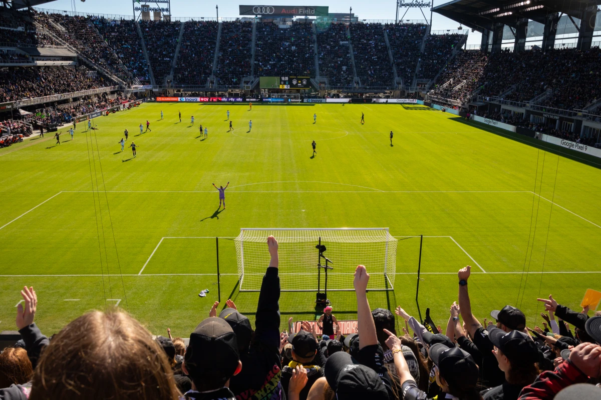 Fans of the Washington Spirit team cheer during the NWSL semifinals in November. In 2021, revelations about sexual misconduct and racism roiled the NWSL and sparked investigations. Now, the women's soccer league will set aside $5 million for victims and implement other reforms.