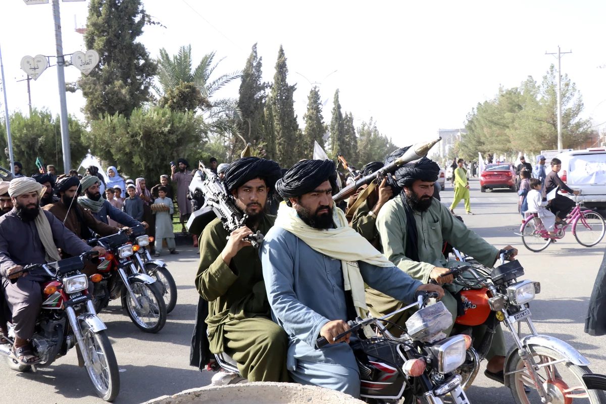 Taliban fighters celebrate the third anniversary of the withdrawal of US-led troops from Afghanistan on Aug. 14, 2024.