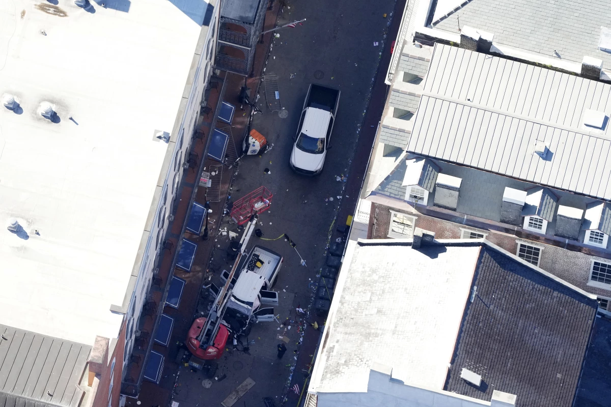The FBI investigates the area on Orleans Street and Bourbon Street by St. Louis Cathedral where a suspicious package was detonated after a person drove a truck into a crowd earlier on Bourbon Street.