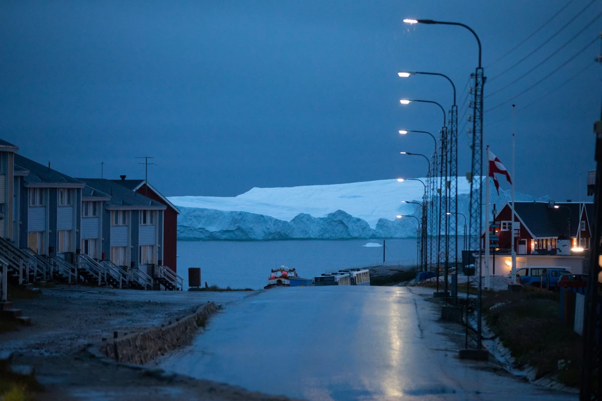 An iceberg floats off the coast of Illulisat, Greenland. Ice sheets in Greenland and Antarctica are melting rapidly, and the risks of drastic melting increase  as the Earth heats up. The melting of Greenland's ice sheet is the second-largest contributor to global sea-level rise. (The largest contributor is water expanding as it warms.)
