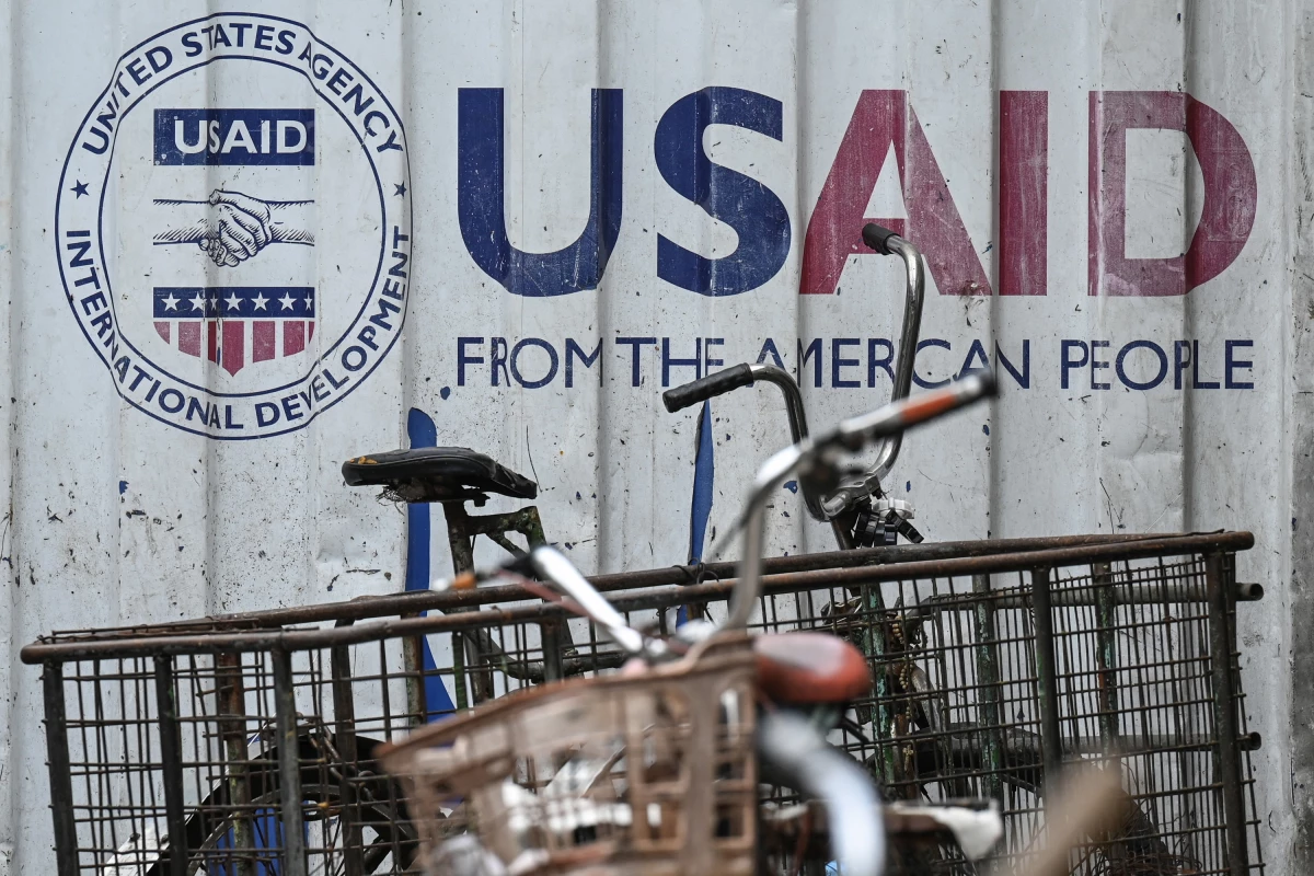 A cargo container in Manila bears signage for the U.S. government's humanitarian agency USAID. The Trump administration suspended most USAID projects; a judge is now calling for the freeze to be lifted.