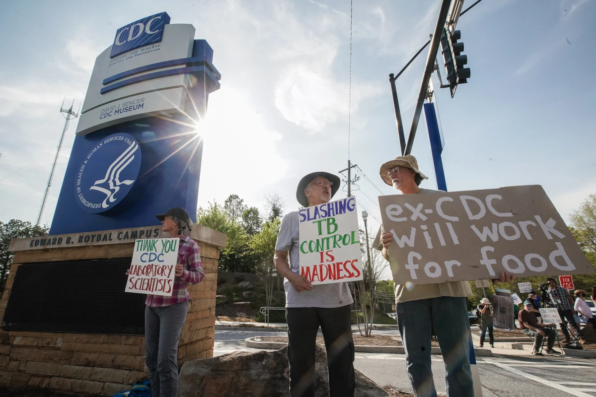 Demonstrators protest staffing cuts outside the Atlanta headquarters of the Centers For Disease Control and Prevention (CDC) on April 1, 2025. Health and Human Services Secretary Robert F. Kennedy Jr. laid off thousands of HHS employees across multiple agencies, as part of an overhaul announced in March, 2025.
