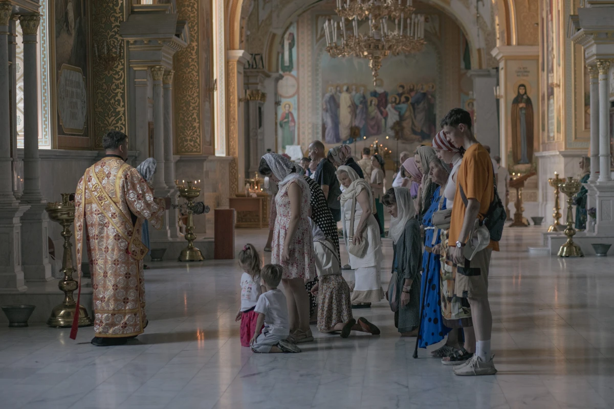 In the Cathedral of the Transfiguration of Our Lord, damaged in a Russian missile strike last summer, services take place in one of the small chapels, seen here on Aug. 17, a testament to the community's enduring faith.