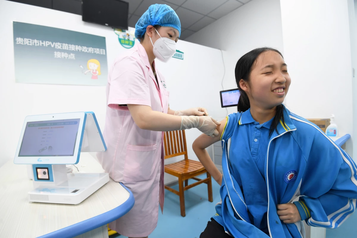 A schoolgirl receives a dose of HPV vaccine at a community health service center in Guiyang, Guizhou province, China.