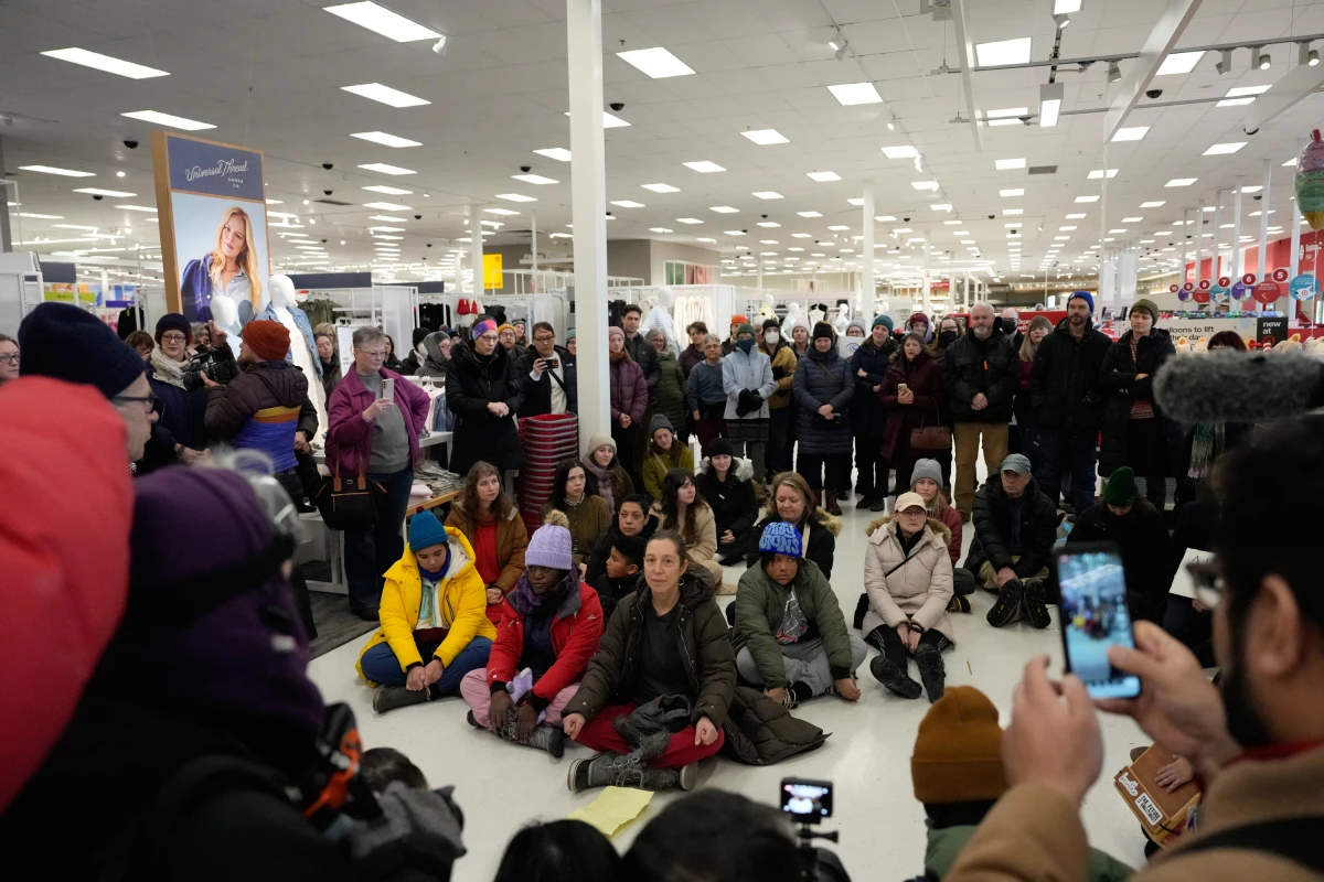 Community members and neighbors of people detained by ICE gather in protest at a Target store on Jan. 19, 2026 in St. Paul, Minn.