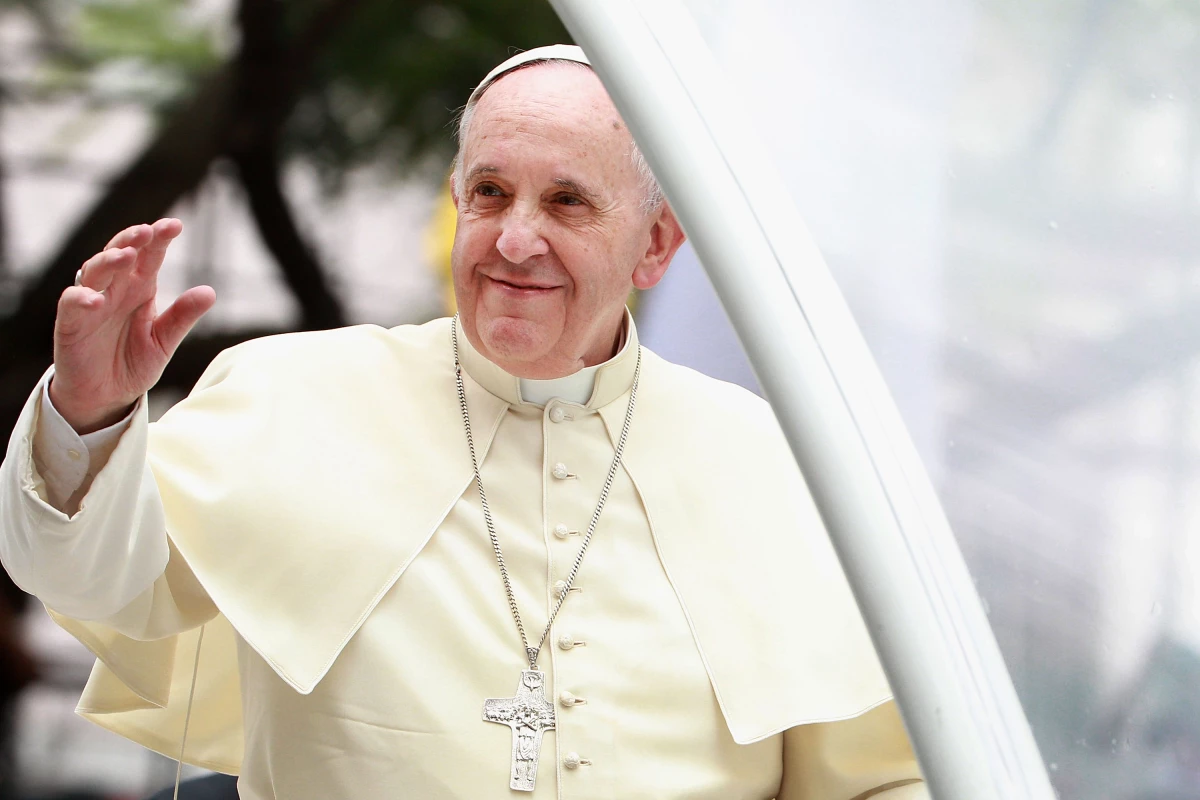 Pope Francis waves to thousands of followers as he arrives at the Philippines' Manila Cathedral on Jan. 16, 2015. During his papacy, Francis strove to reach out to what he called the 'periphery' of the world in Asia, Africa and Latin America.