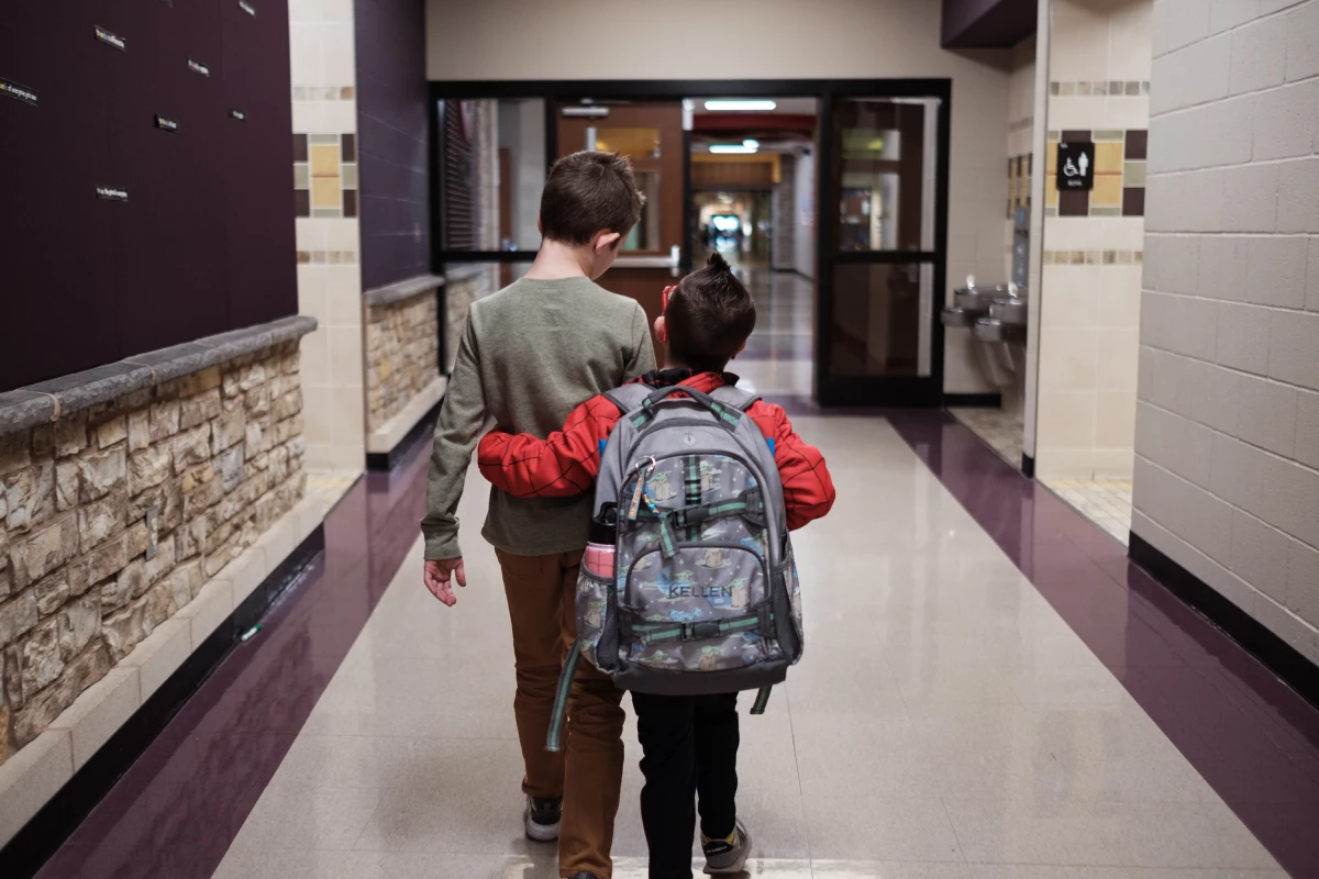 Kellen and his best friend, Nolan, leave their classroom together at the end of the day. 
