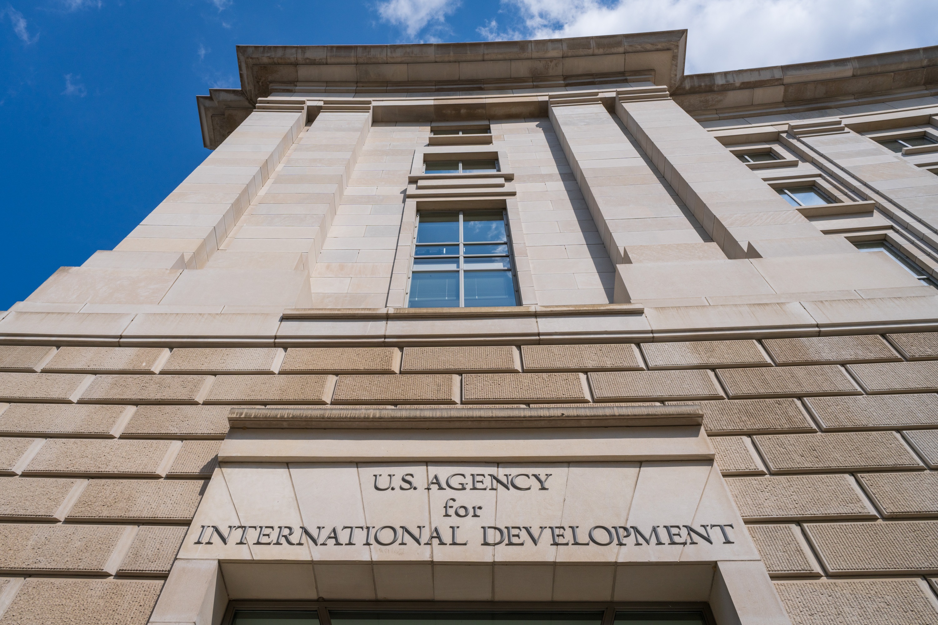 The front of the U.S. Agency of International Development headquarters in Washington, D.C.  The agency funds projects that aim to alleviate poverty and disease and serve humanitarian needs  around the world. A round of layoffs this week terminated nearly 400 contract employees.