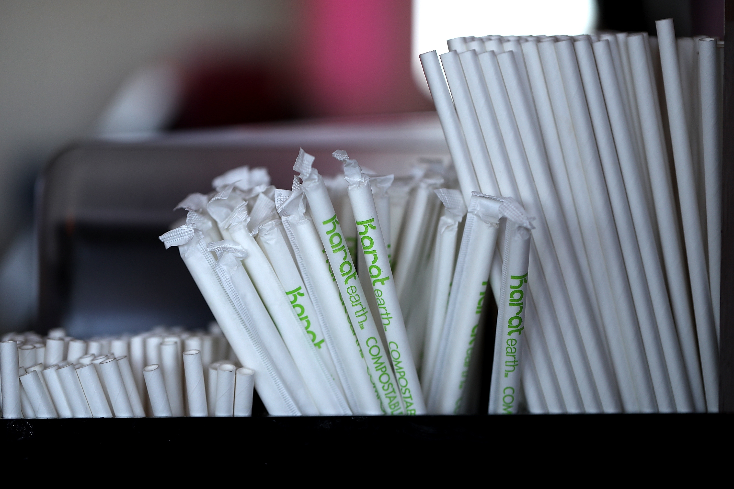 Paper straws sit on a bar in San Francisco in 2018. President Trump has signed an executive order decrying the "irrational campaign against plastic straws" and directing federal agencies to stop buying paper straws.