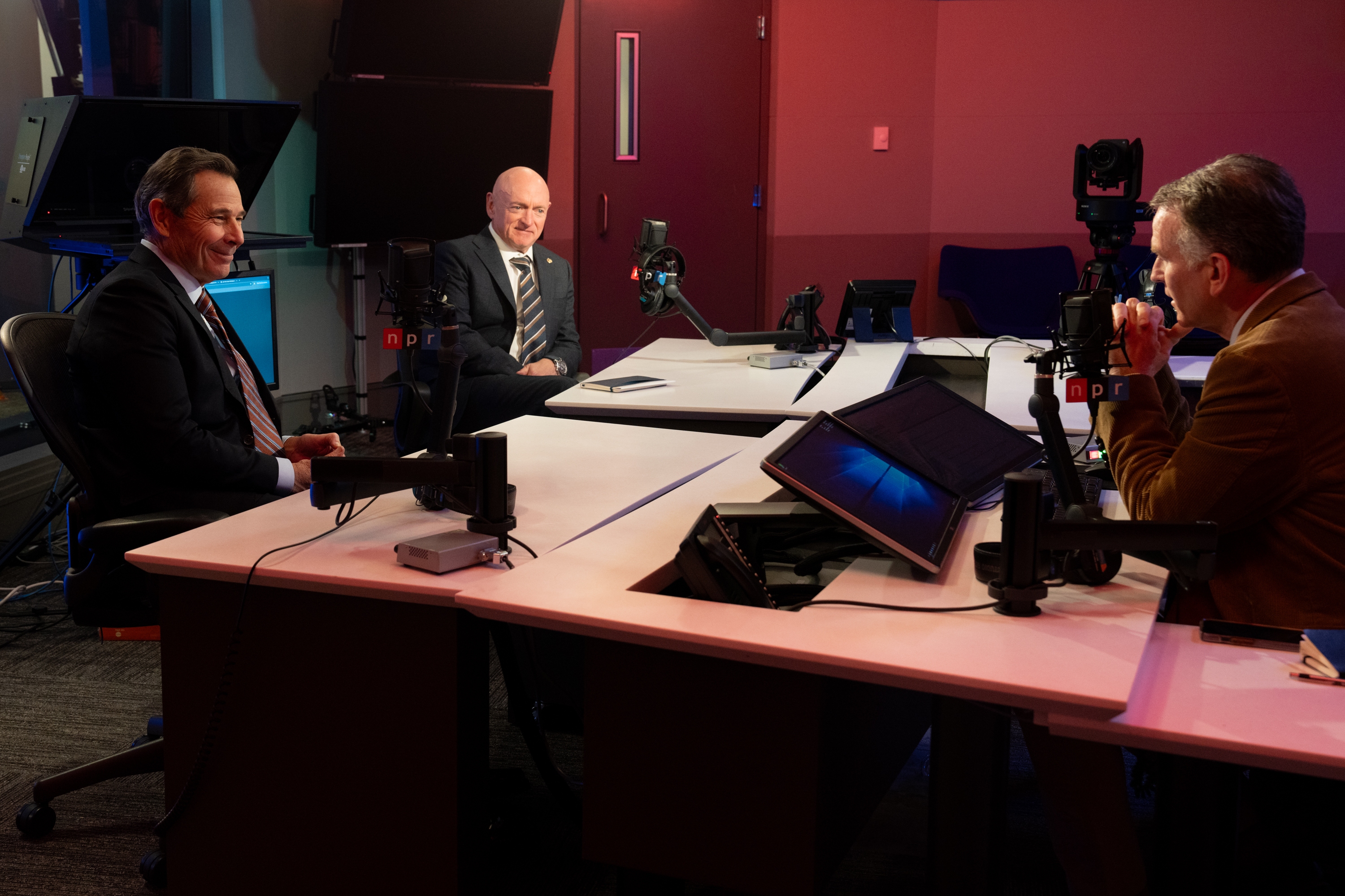 (From left) Sens. John Curtis, R-Utah, and Mark Kelly, D-Ariz., discuss their joint effort to hold big tech accountable for harms caused by social media algorithms with NPR