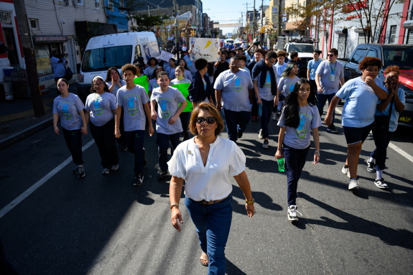 Philadelphia City Councilor Quetcy Lozada, a Harris backer, walks with students during a gun violence march on Sept. 20.