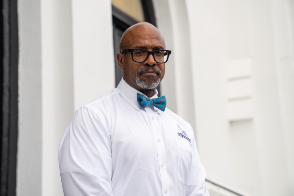Current pastor Rev. Eric Manning stands outside Mother Emanuel African Methodist Episcopal Church in Charleston, SC on June 3, 2025.