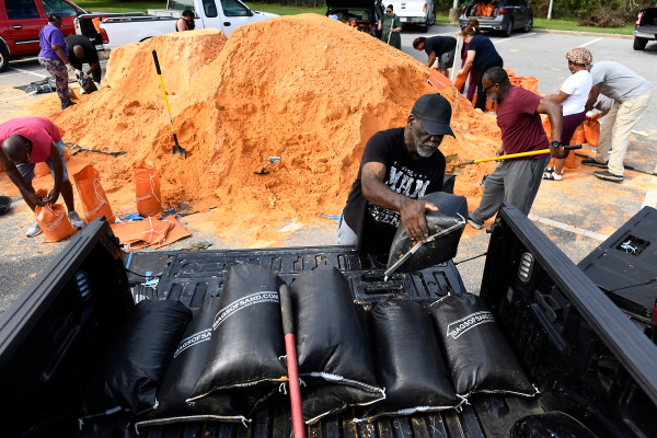 Residents pick up sandbags for storm preparation at the James Seals Jr. Parks & Recreation Center ahead of Hurricane Isaias' expected landfall along the Gulf Coast, Thursday, Oct. 8, 2026, in Mobile, Ala.
