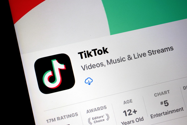 A smartphone screen displays TikTok in an app store as available for download.