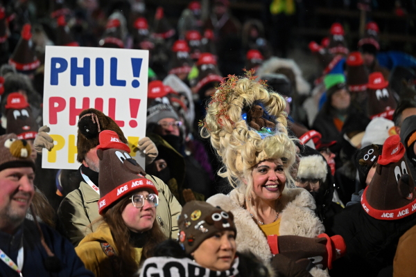 Toni Massey, of Bismack, N.D., right, celebrates while waiting for Punxsutawney Phil, the weather prognosticating groundhog, to come out and make his prediction during the 140th celebration of Groundhog Day on Gobbler's Knob in Punxsutawney, Pa., Monday, Feb. 2, 2026.