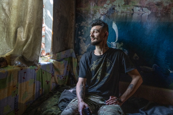 Nur (call sign "Shaitan"), an artillery unit commander for the 57th brigade, poses for a portrait inside a command center in Kharkiv region, Ukraine on May 29.