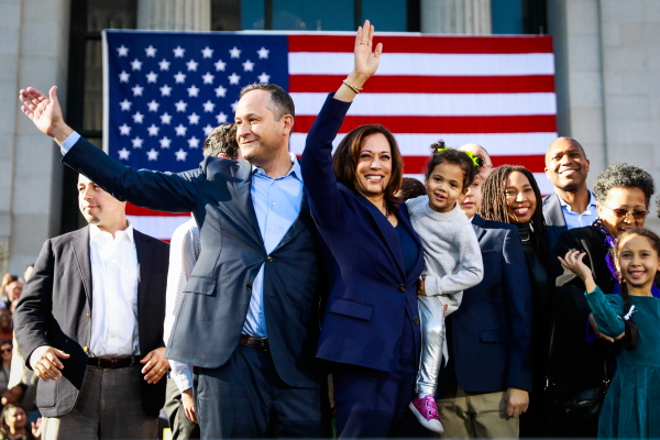 Senator Kamala Harris holds her niece Amara as she and her husband Douglas Emhoff wave to the crowd after hosting her first presidential campaign rally in her hometown of Oakland, California, on Sunday, Jan. 27, 2019.