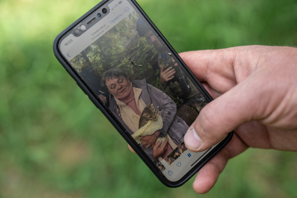 Oleksii Kharkivskyi, the chief of the patrol police of Vovchansk, shows videos he filmed during evacuations of civilians from Vovchansk in Kharkiv Oblast, Ukraine, on May 26.