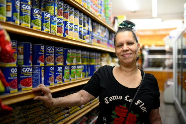 Sonia Concepcion stands for a portrait at 5th Street Supermarket in the Hunting Park neighborhood of Philadelphia on Sept. 20.