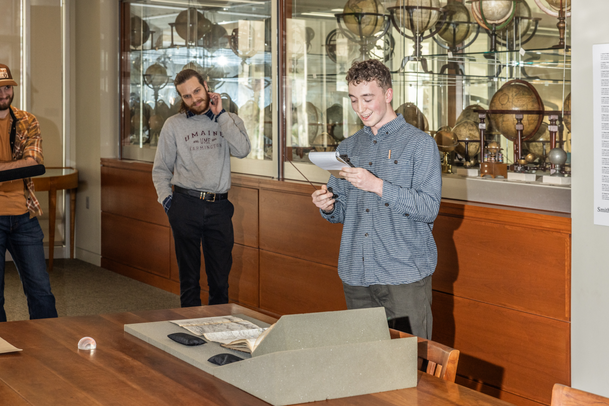 A student from the class Geography 370: Maps, Territory, and Power explains their project relating to maps.