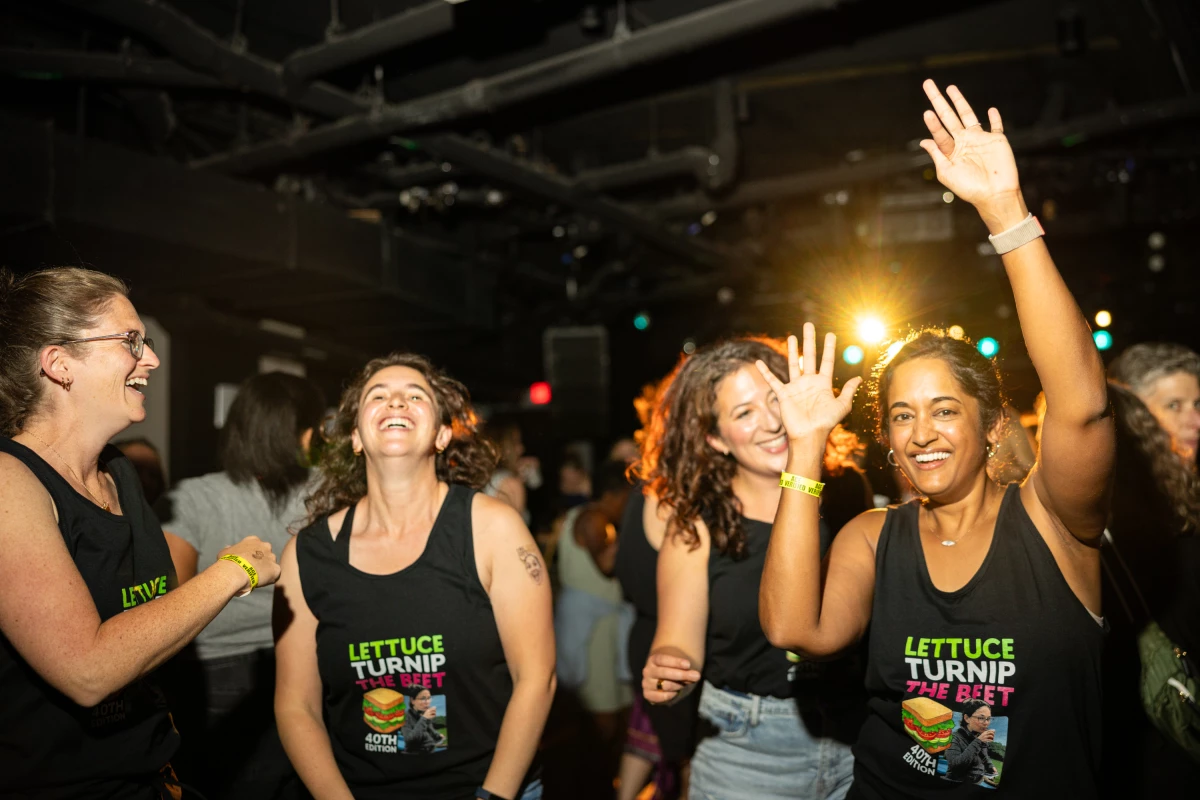 Lindsey Falasca (left) dances with her friends in matching shirts as they celebrate her 40th birthday.