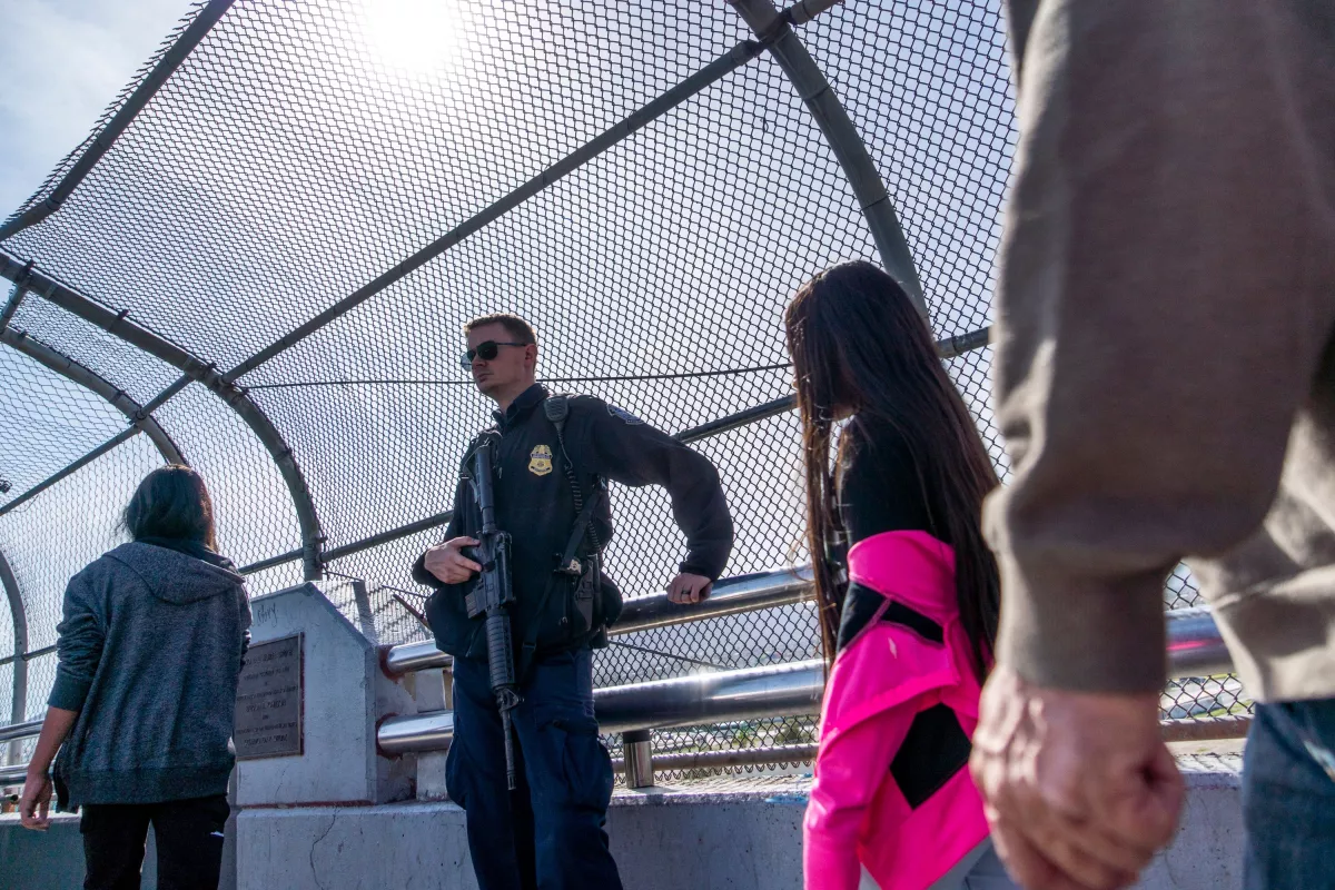 A Customs and Border Protection officer is pictured guarding the middle of the Paso Del Norte Bridge on November 4, 2018, in El Paso, Texas.