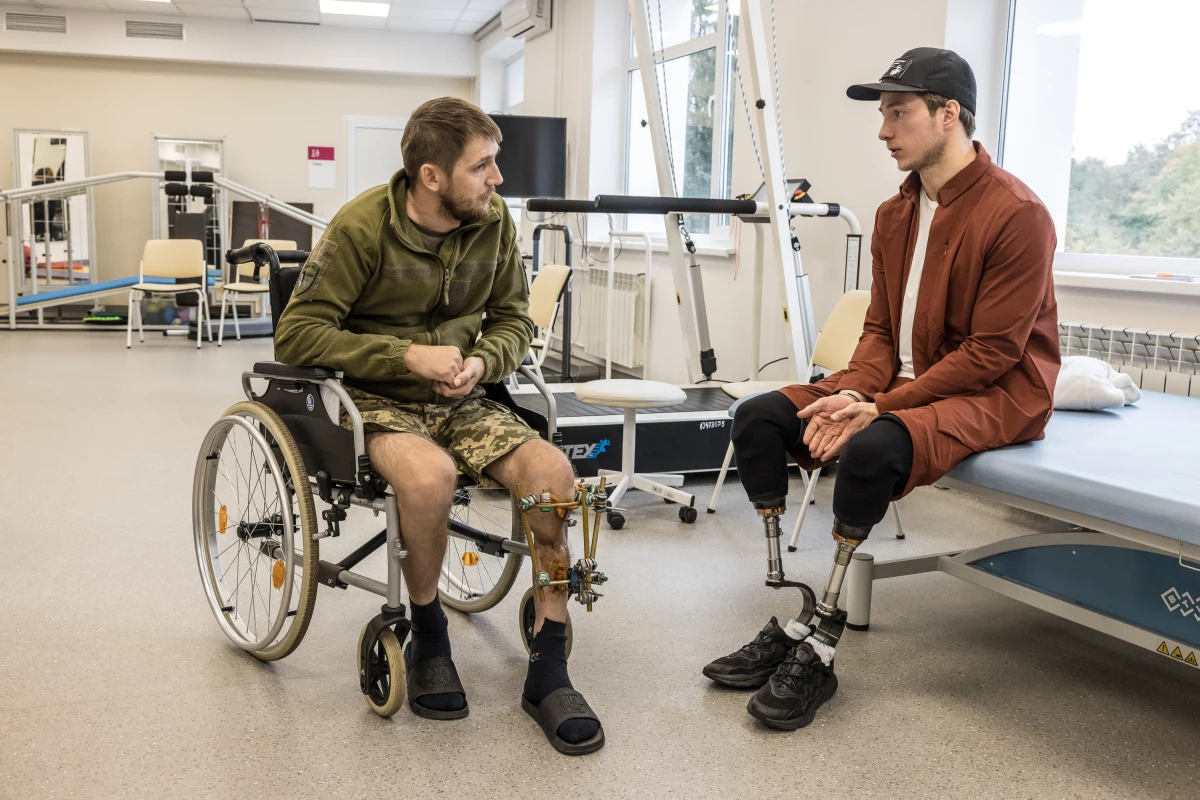 Ukrainian war veteran Oleksandr Budko (right) talks to an injured soldier, Mykola Kovalenko, 36, at the Recovery rehabilitation center in Kyiv, Ukraine, on Oct. 18.