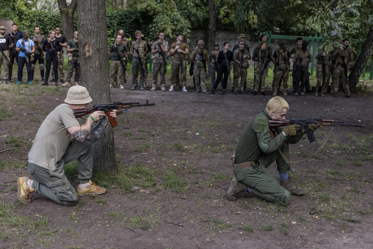 Ukrainians learn to use weapons during 'Test Week' for civilians, in Kyiv, Ukraine, on Aug. 7.
