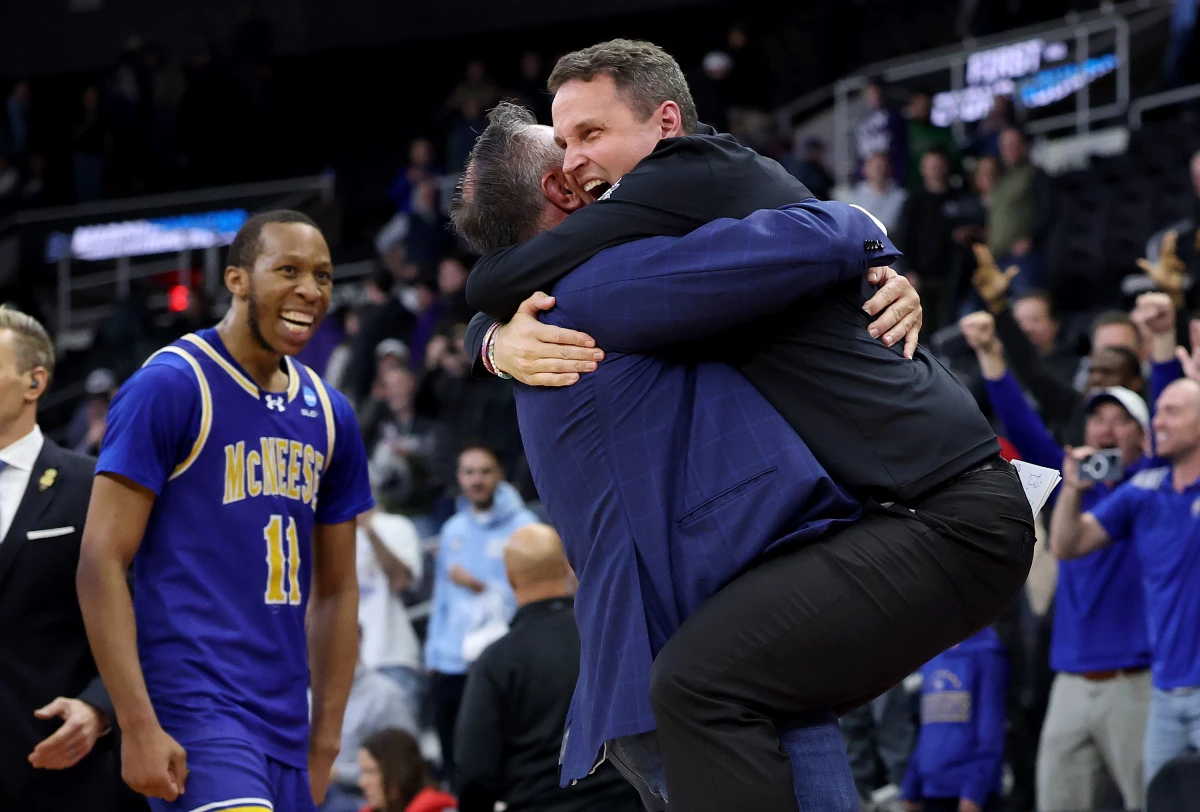 Head coach Will Wade of the McNeese State Cowboys celebrates after defeating the Clemson Tigers 69-67 in the first round of the NCAA Men's Basketball Tournament on March 20, 2025 in Providence, Rhode Island.