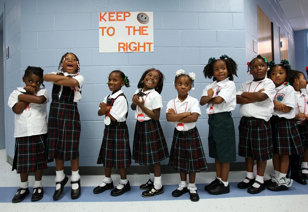 Kindergartners smile on their first day of school at Dr. Martin Luther King Jr. Charter School for Science and Technology in the Lower 9th Ward on Aug. 20, 2007, in New Orleans.