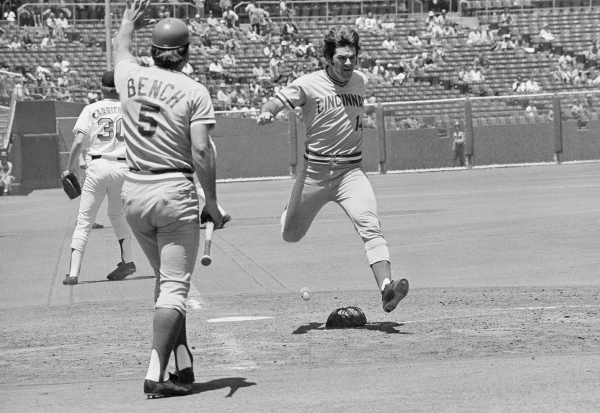 Pete Rose, right, who rapped out his 2,000th career hit during this series in San Francisco, flies across the plate on June 20, 1973. Known as "Charlie Hustle", Rose endeared himself to scores of fans and then endured their anger after he was kicked out of the sport in 1989 for gambling.