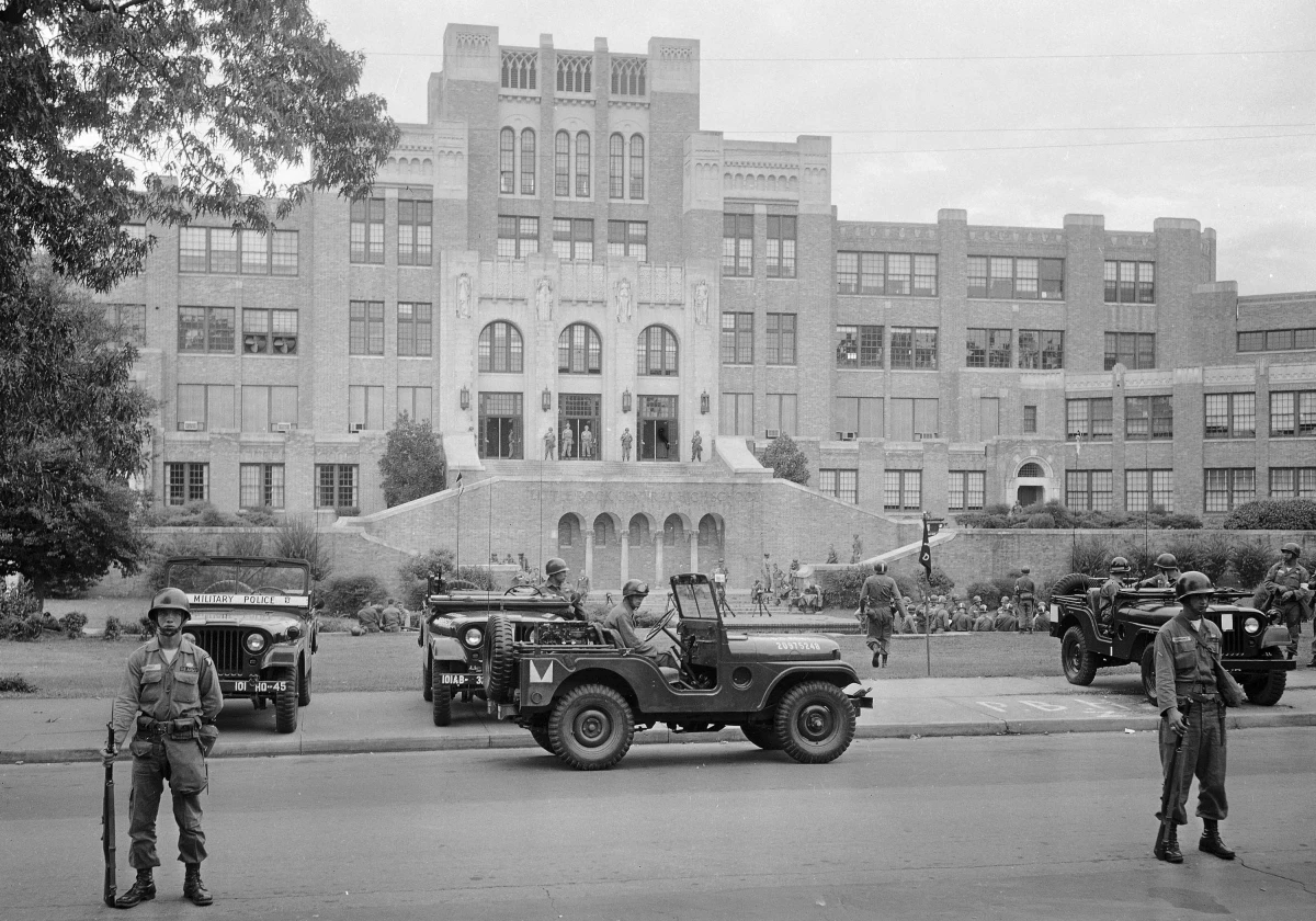 Members of the 101st Airborne Division take up positions outside Central High School in Little Rock, Ark., on Sept. 26, 1957. The troops were on duty to enforce integration at the school.