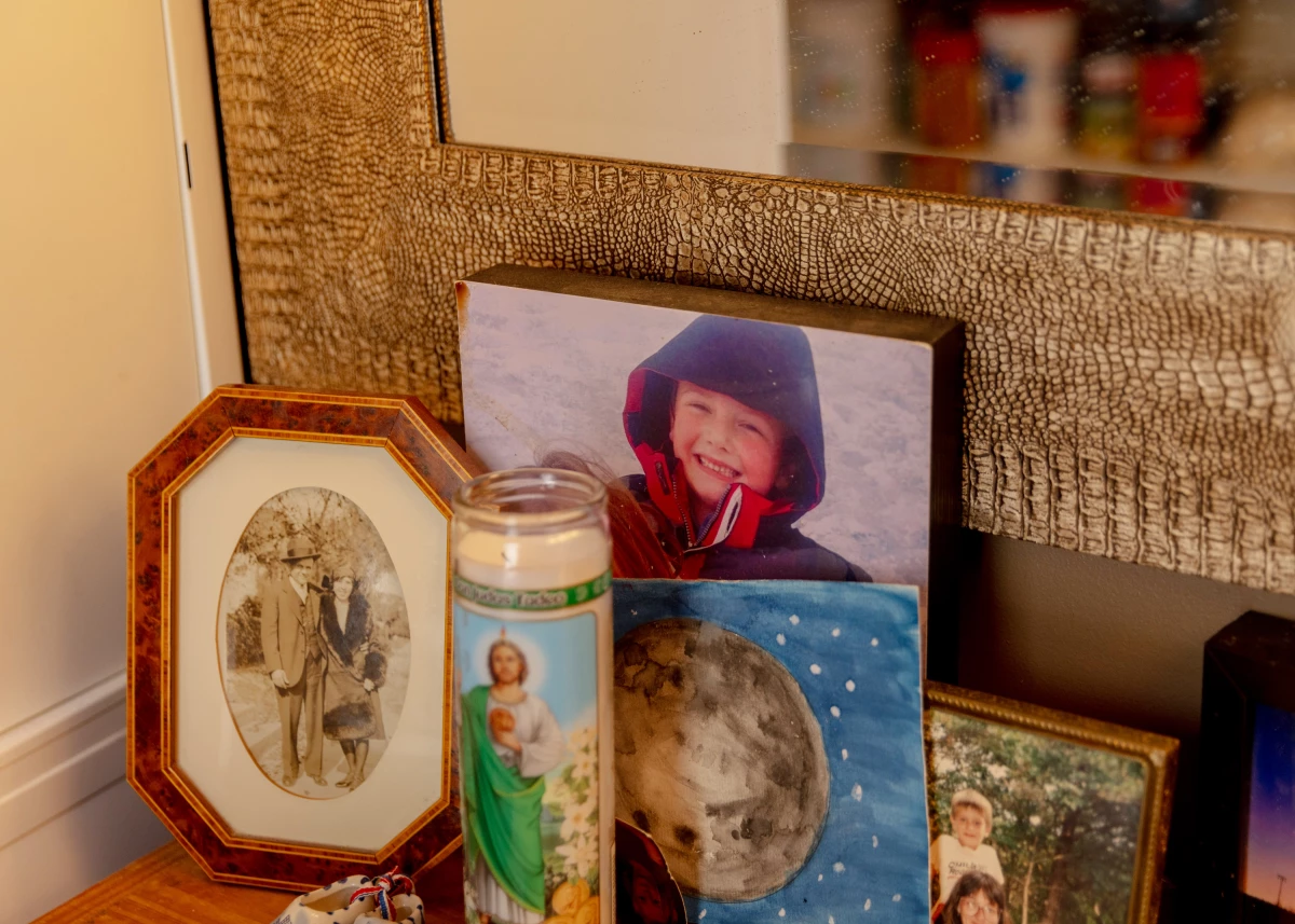 A framed photograph of Logan and his sister, Ayden, sits on a table in the entry of the family's home in Newton, Mass.