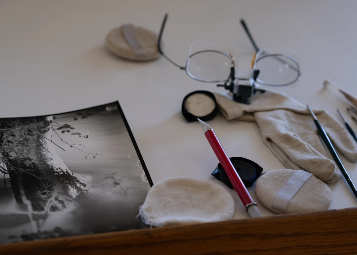 A print and glasses at Sally Mann's Virginia home studio.