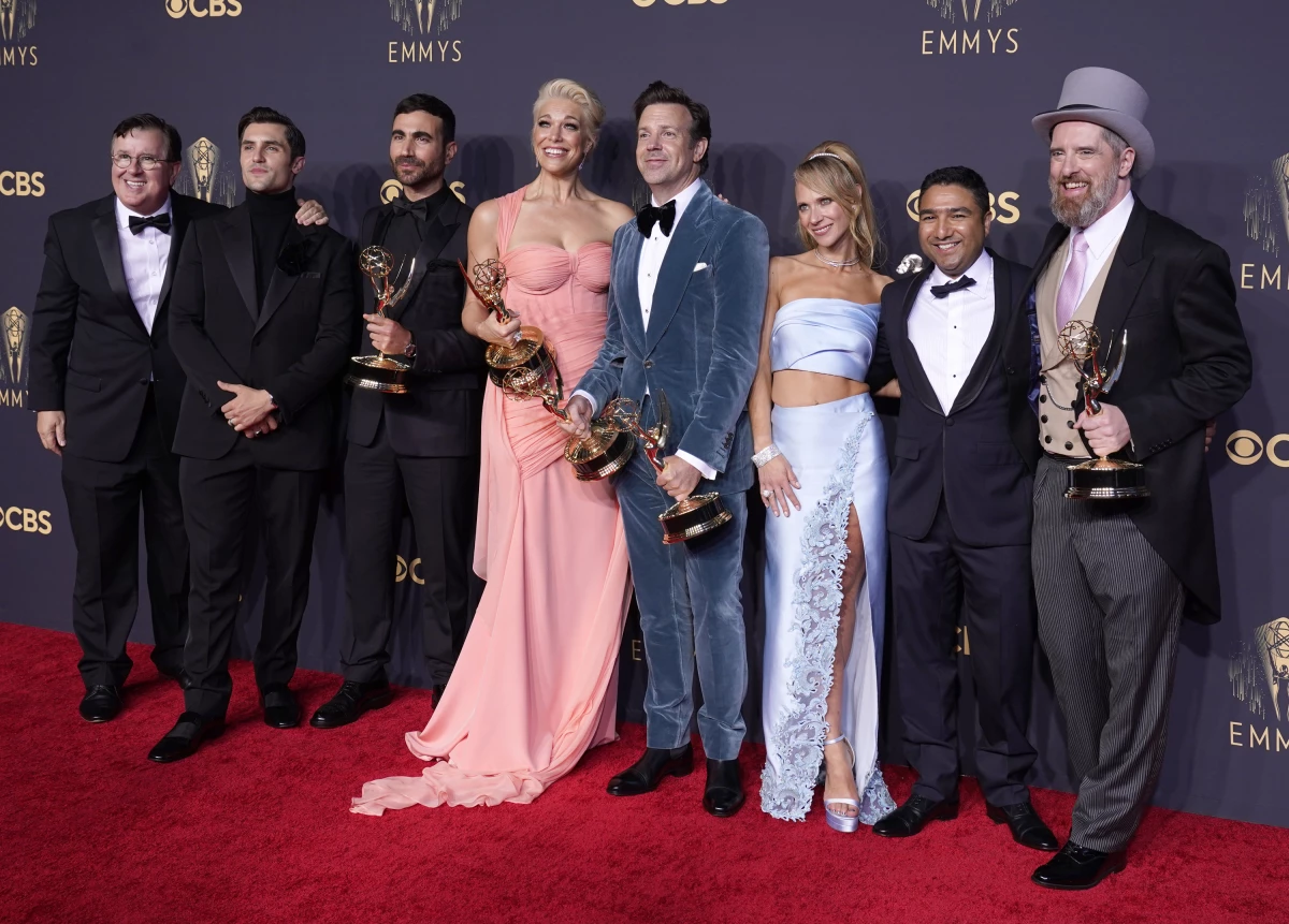 Brett Goldstein (from left), Hannah Waddingham, Jason Sudeikis, Juno Temple and the cast and crew from Ted Lasso — about an American college football coach who is hired to manage a London soccer team — pose with their awards at the 73rd Primetime Emmy Awards on Sept. 19, 2021, in Los Angeles.