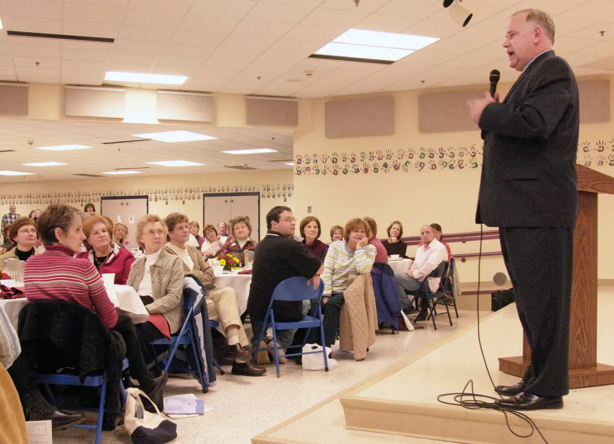 Then-Democratic congressional candidate Tim Walz talks with a teachers group during a campaign stop in Mankato, Minn., on Oct. 25, 2006.