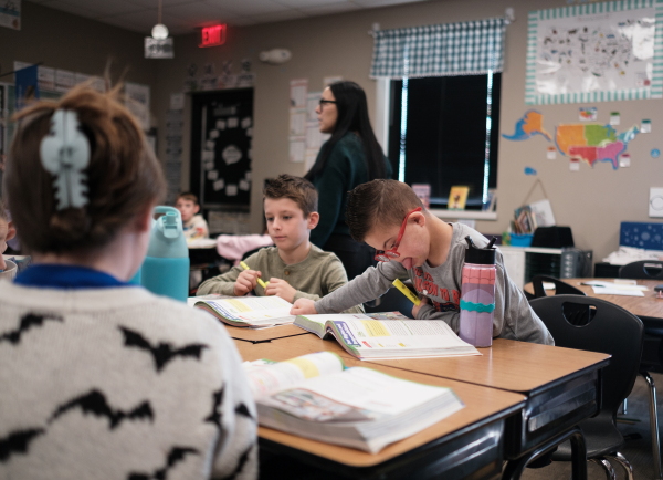 Kellen and his classmates, including his best friend, Nolan Robbins (left), learn about the structure of the U.S. government with teacher Robyn Fox.