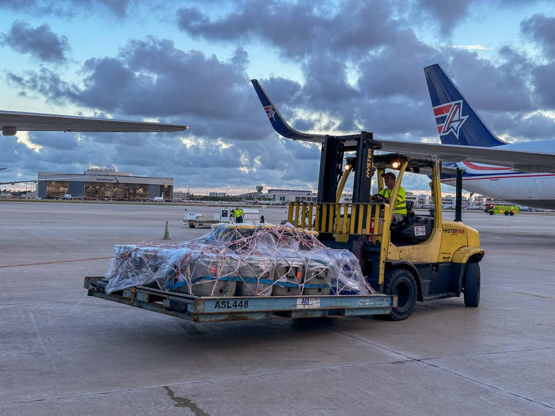 A forklift at Miami International Airport moves coolers containing elkhorn and brain coral shipped to Miami from Honduras in June.