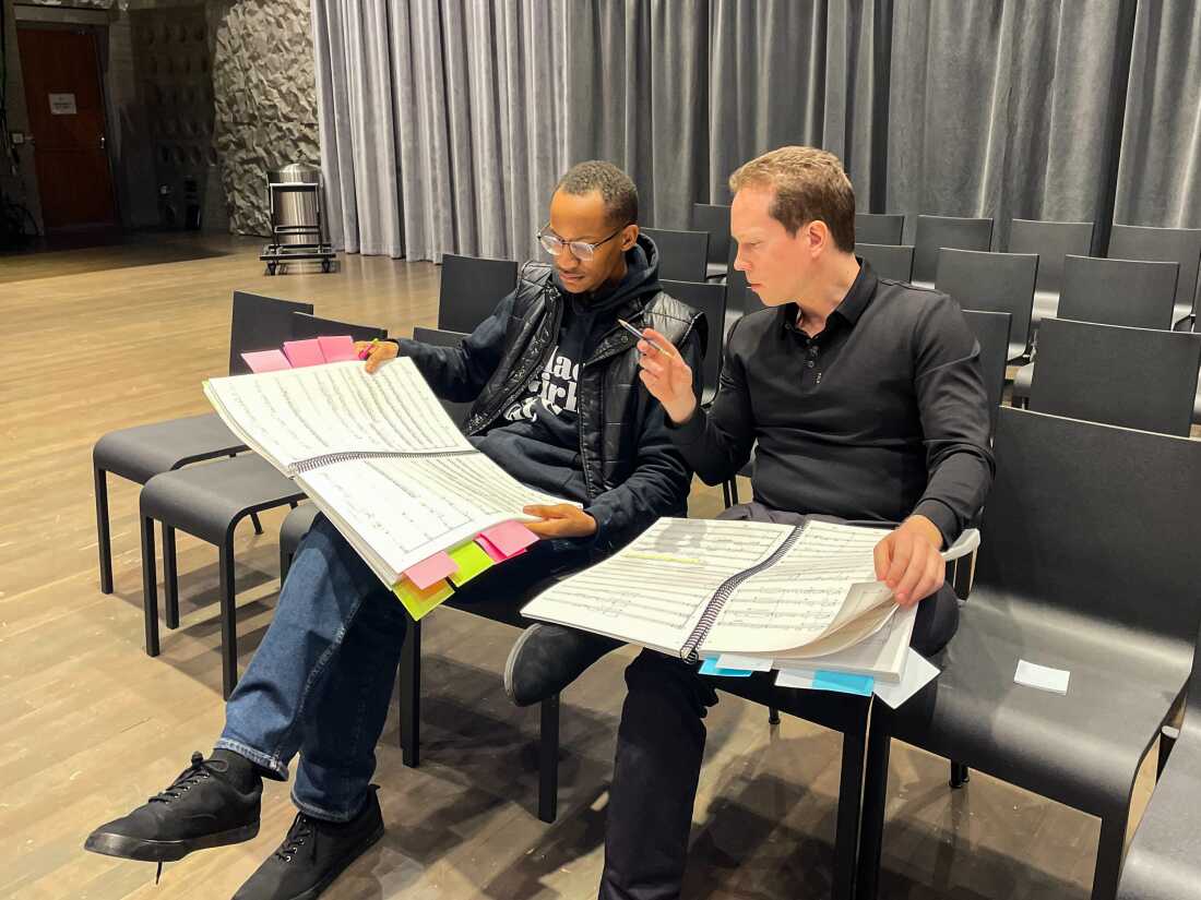 Composer Jaylin Vinson, left, discusses his opera Future of Dreams with conductor Joshua Horsch.