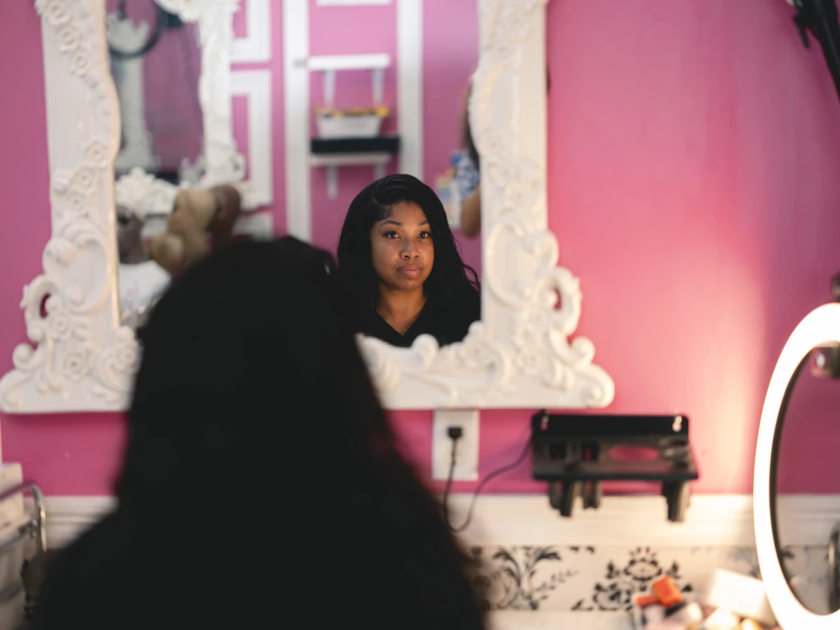 Brittany Penn, owner of Lace Exclusive Salon on Desire Street, poses in her salon in the upper 9th ward in New Orleans, Louisiana, on August 26, 2025. Hair extensions is one of Penn's many businesses and she invests it all back in the community - including affordable housing.