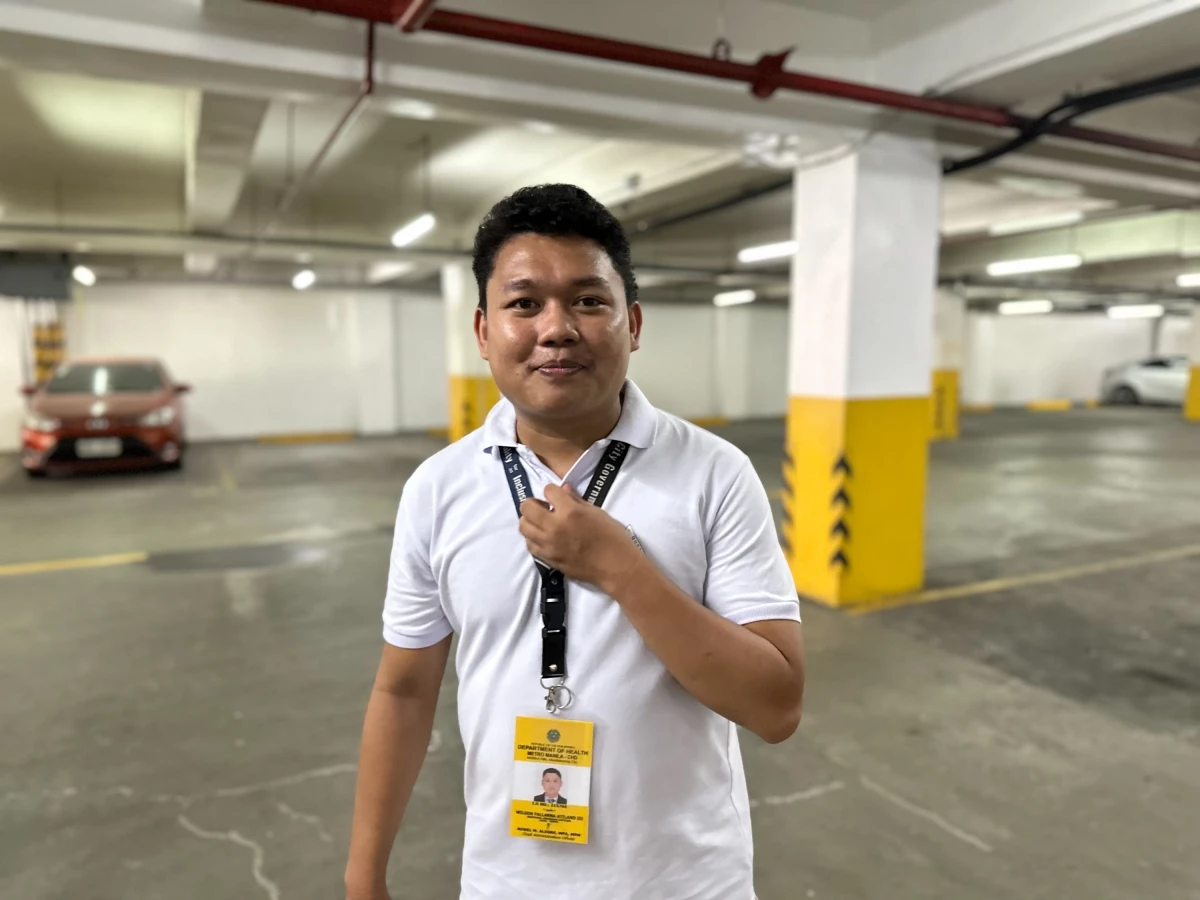 Wilson Atilano works with the Department of Health in Manila to make HIV testing and care more accessible. Above: He's standing in a mall's underground parking garage, where a park-and-test clinic opened this summer.