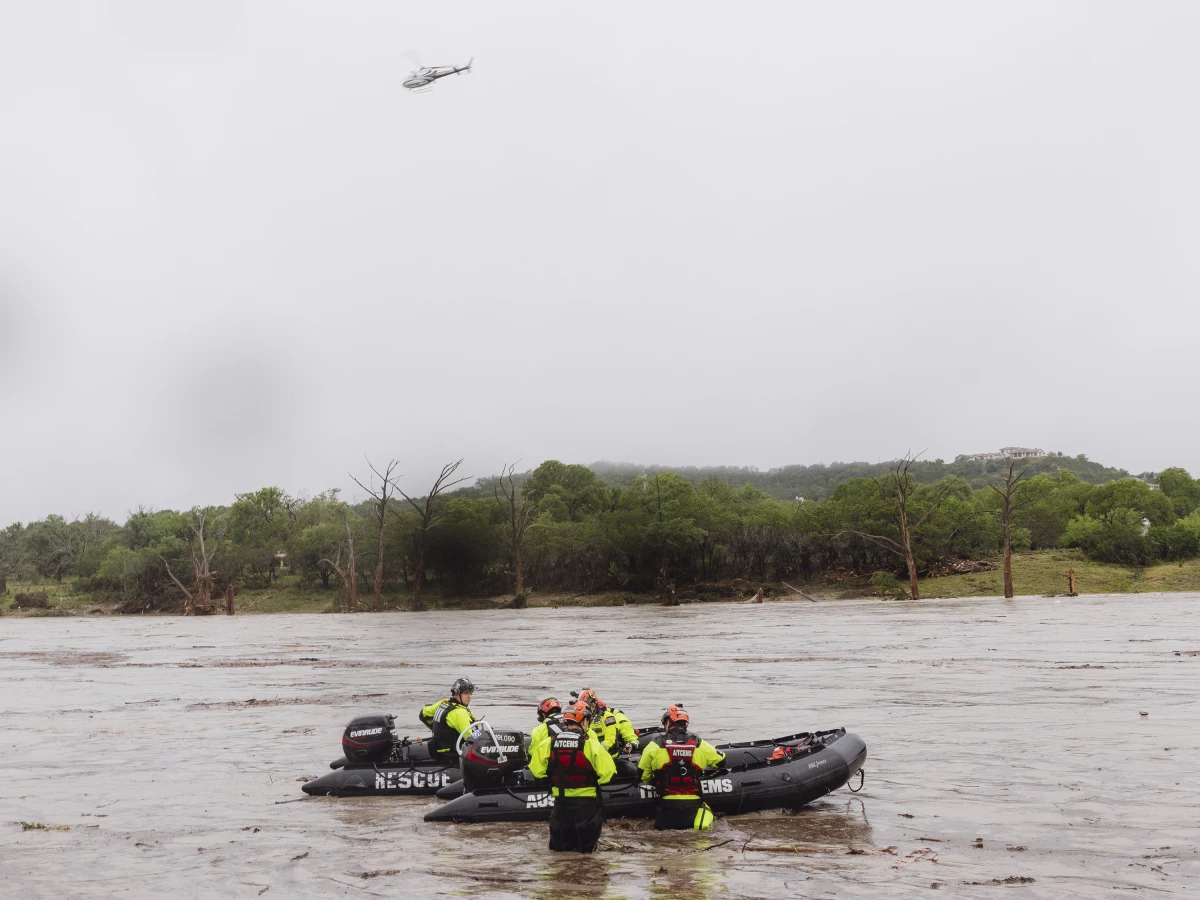 First responders deploy boats along the Guadalupe River after deadly flooding on Friday in Kerrville, Texas.