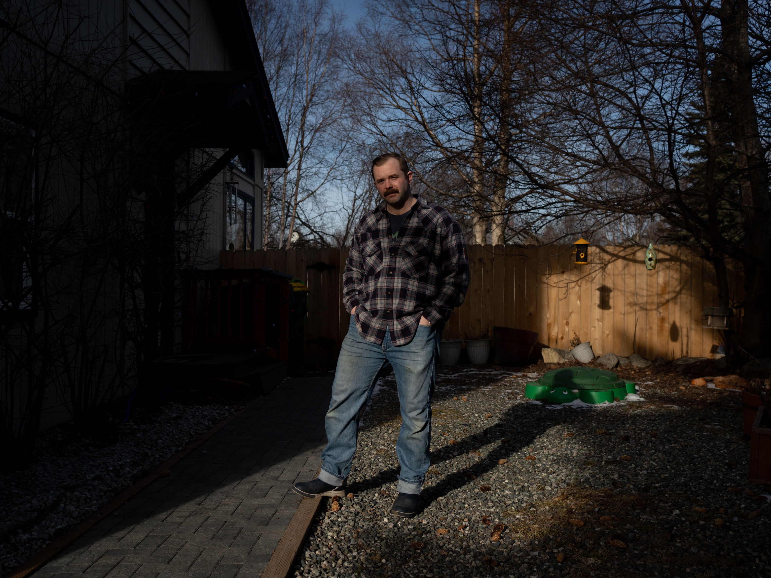 Mike Macans stands for a portrait outside of his home in Anchorage, Alaska, on Feb. 23, 2025. Macans served in the U.S. Army for five years and was most recently working as a disaster recovery coordinator for the Small Business Administration. He was officially terminated from his job on Feb. 11, 2025.