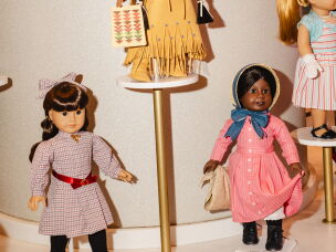 American Girl dolls — Samantha (from left), Kaya and Addy — are on display.