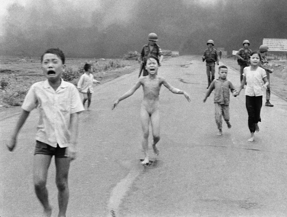 Children flee a napalm attack in Trảng Bàng on June 8, 1972. Left to right: Phan Thanh Tam, who lost an eye, Phan Thanh Phouc, Kim Phuc, and Kim's cousins Ho Van Bon, and Ho Thi Ting. The "Napalm Girl" photograph galvanized an anti-war movement in the United States. (AP)