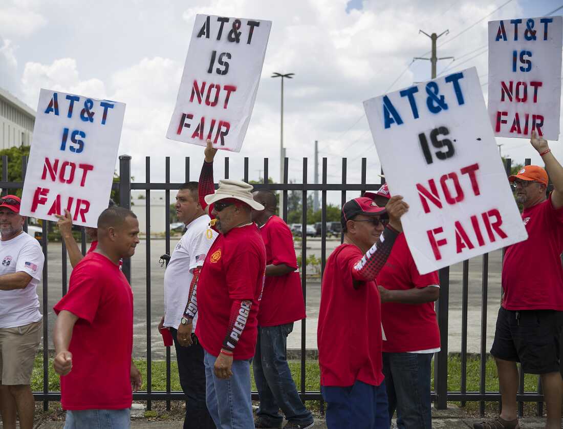17,000 AT&T workers have been on strike for three weeks : NPR