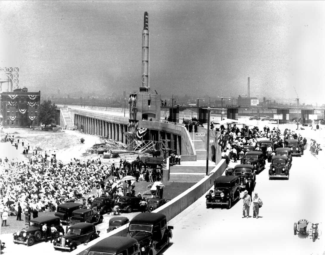 The Triborough Bridge, the new thoroughfare connecting Manhattan, the Bronx and Queens, is officially opened in ceremonies held on Randall's Island, New York, July 11, 1936. In attendance is Robert Moses, along with President Franklin Roosevelt, New York Gov. Robert H. Lehman and New York City Mayor Fiorello La Guardia.
