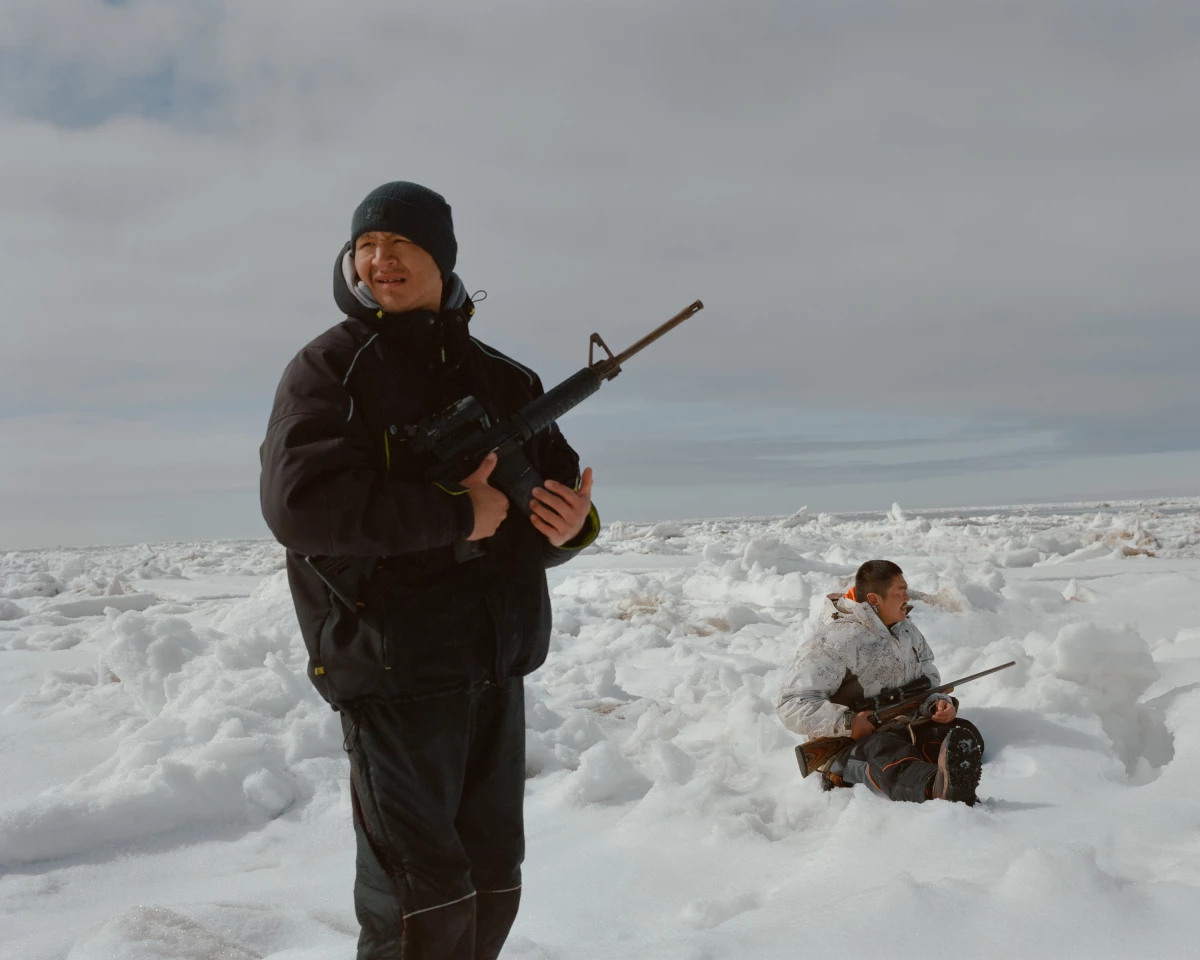James Joseph (left) and Albert Simon (right) scout for game on an ice floe several miles offshore of Hooper Bay, Alaska. Both have lost close friends to suicide. Despite seal hunting being identified by CANHR as a protective activity they’d like to support, the organization has had trouble getting funding for it over liability concerns.