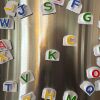 Alphabet letters on the fridge with "K" and "C" centered